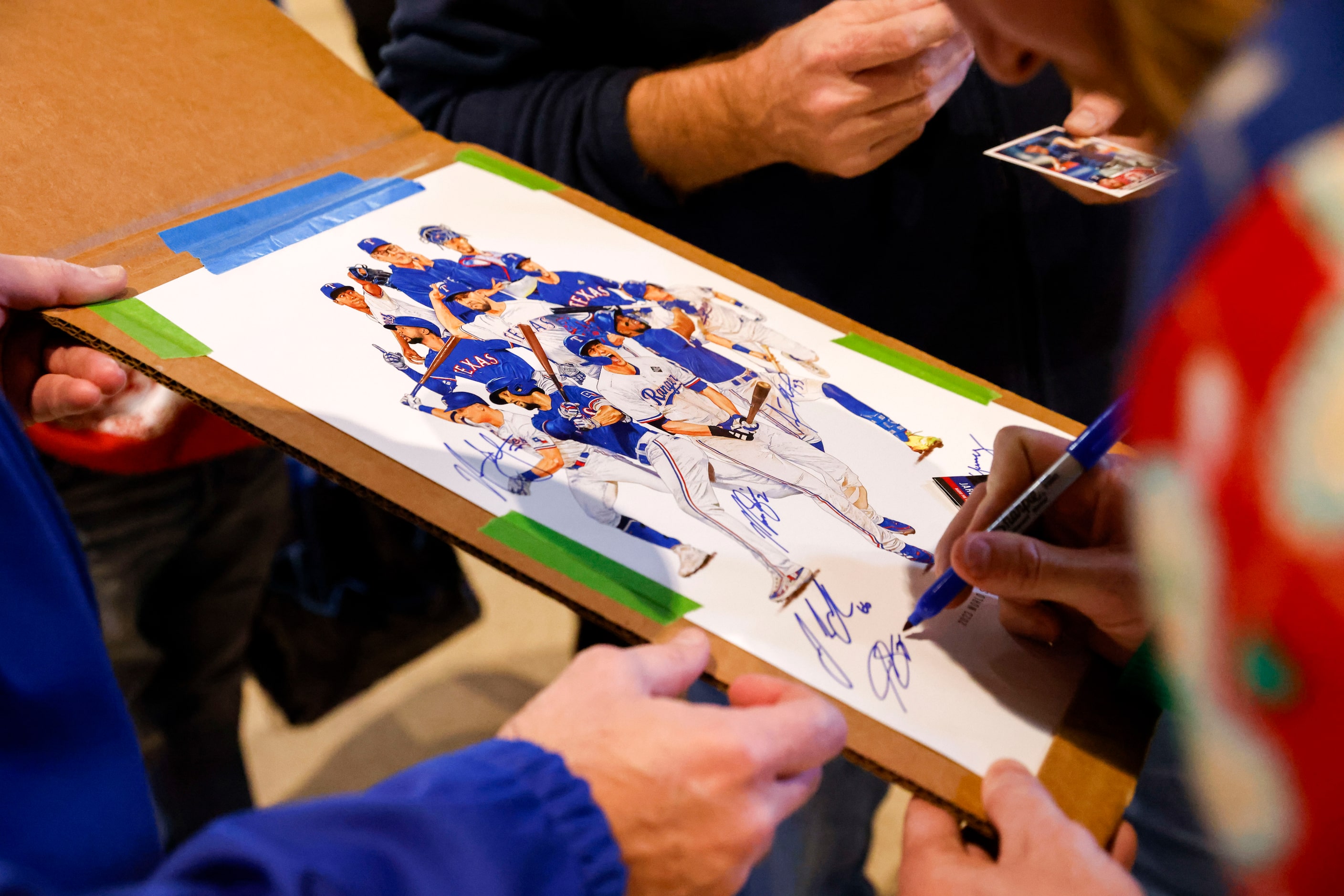 Texas Rangers pitcher Jon Gray gives autographs to fans during Texas Rangers Toy Drive on,...