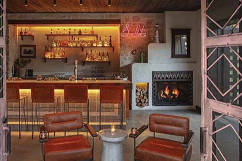 Upscale bar with leather chairs and fireplace