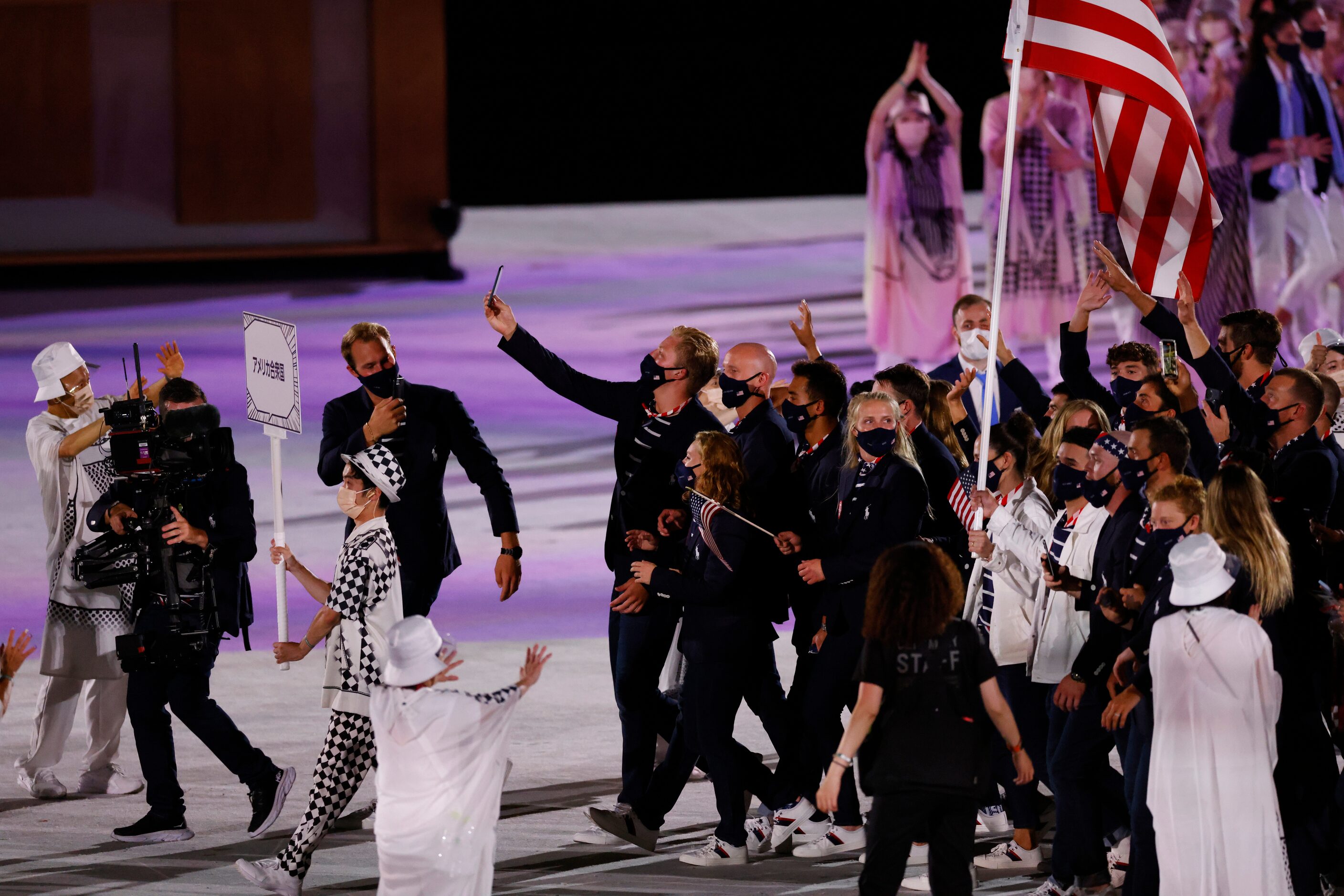 Team USA makes their way across the stage during the introduction portion of the opening...