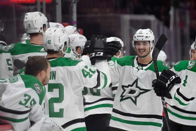 Dallas Stars right wing Nick Caamano, right, celebrates his goal during the third period of...