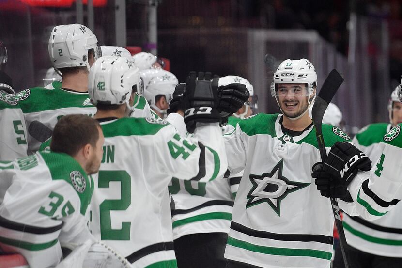 Dallas Stars right wing Nick Caamano, right, celebrates his goal during the third period of...