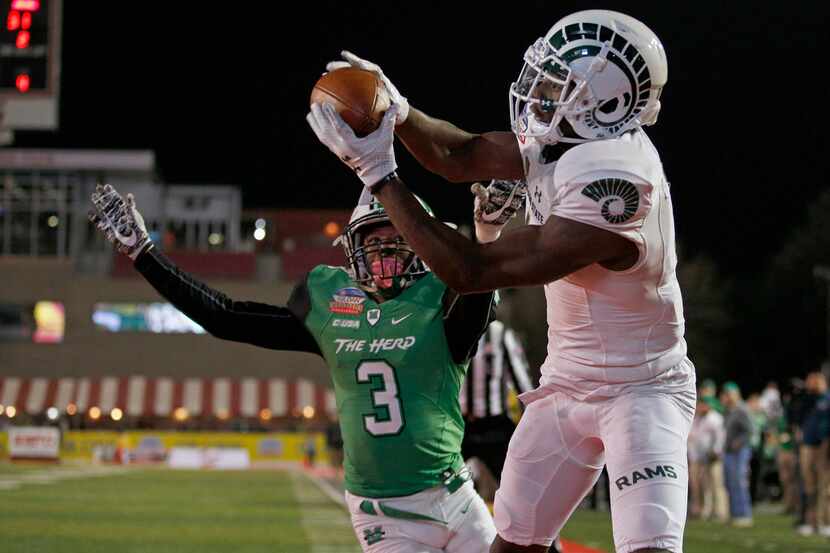 Colorado State wide receiver Michael Gallup, right, catches a pass just outside the end zone...