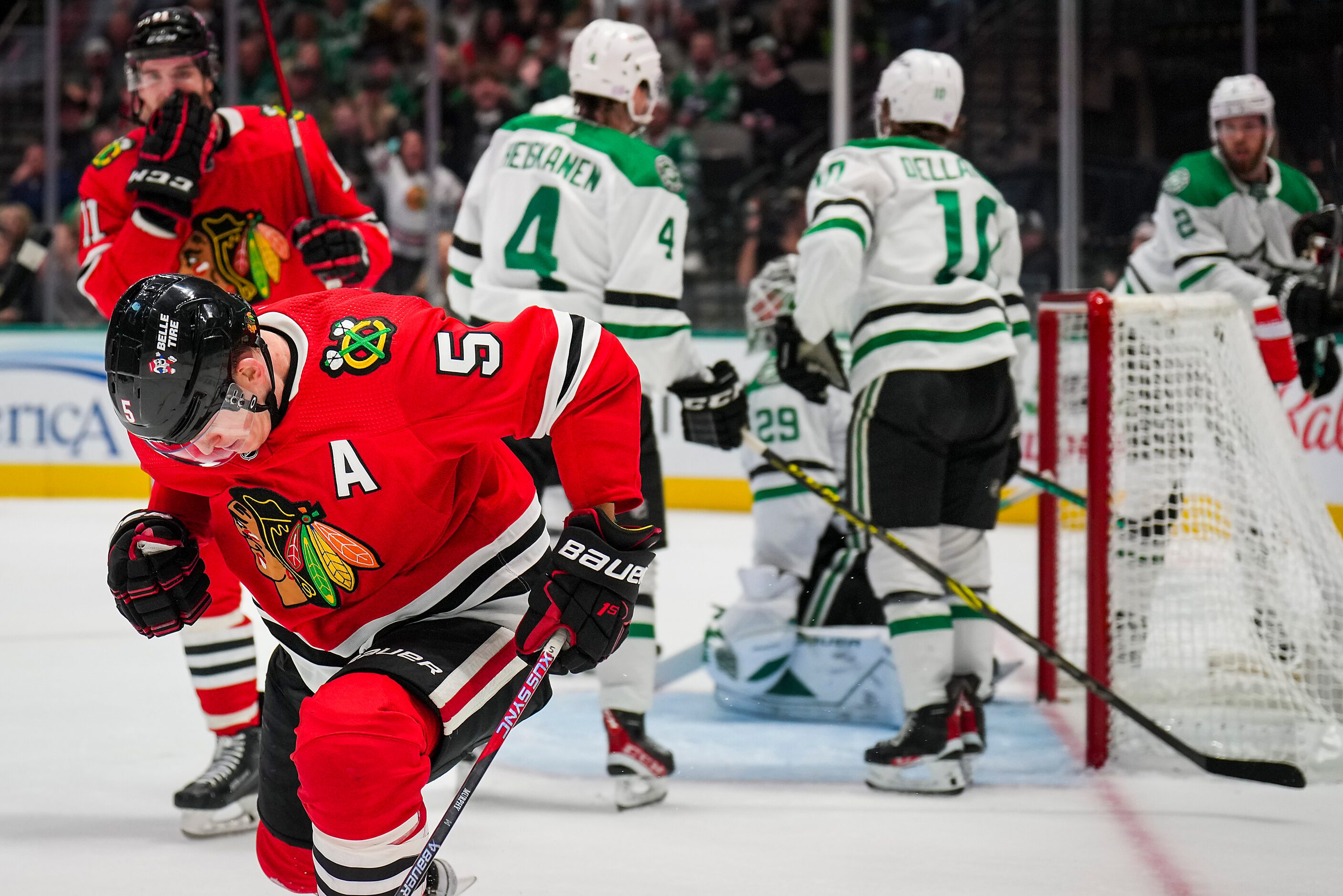 Chicago Blackhawks defenseman Connor Murphy (5) celebrates after beating Dallas Stars...