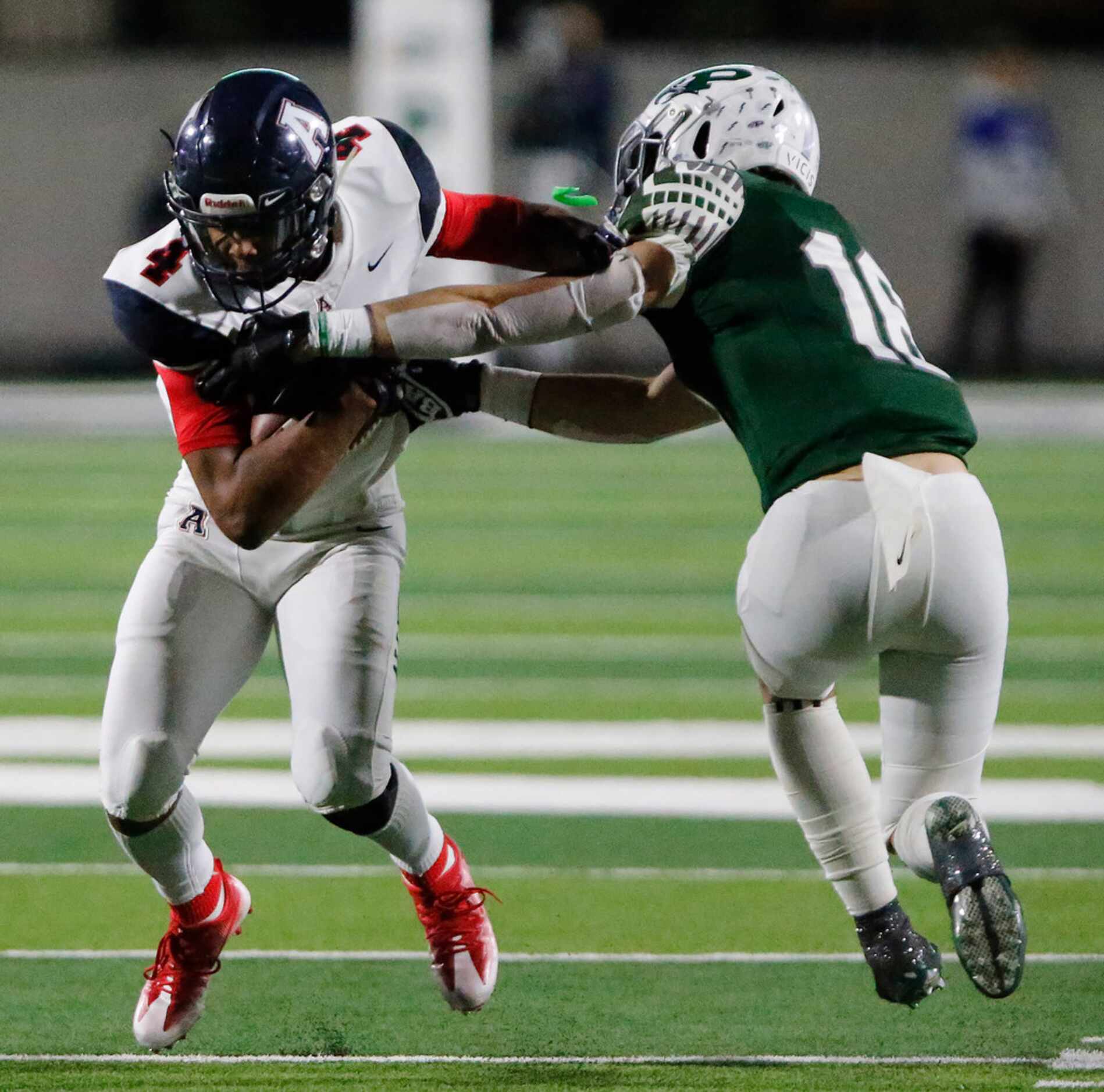 Allen High School wide receiver Darrion Sherfield (4) catches a pass while defended by...