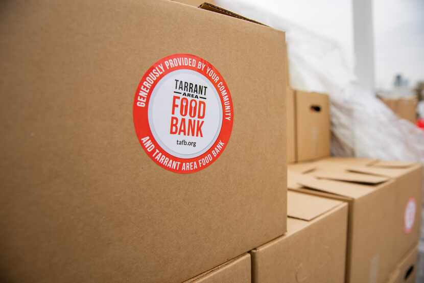 A box of food from the Tarrant Area Food Bank in a parking lot of Globe Life Field in...
