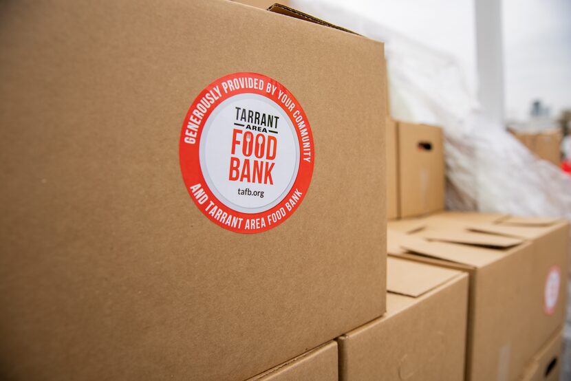 A box of food from the Tarrant Area Food Bank in a parking lot of Globe Life Field in...