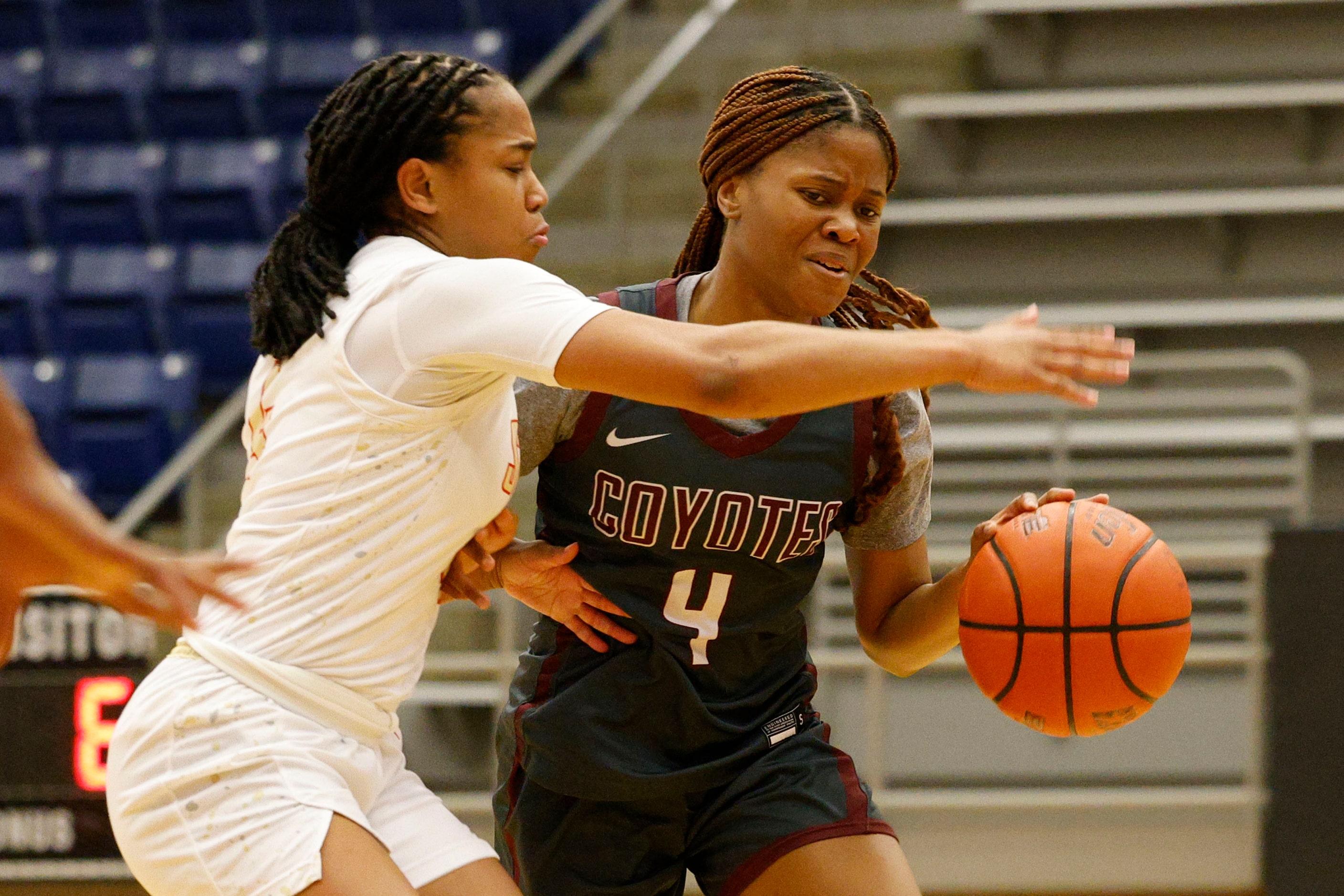 Frisco Heritage's Madison Ravin (4) tries to drive past South Grand Prairie's Camille...