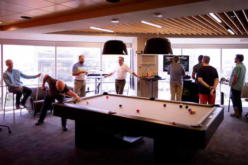 Systemware workers played billiards and video games during a party celebrating employee...