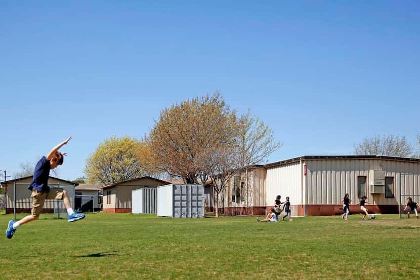 
Students play near portable classrooms at Stonewall Jackson Elementary, which is among...