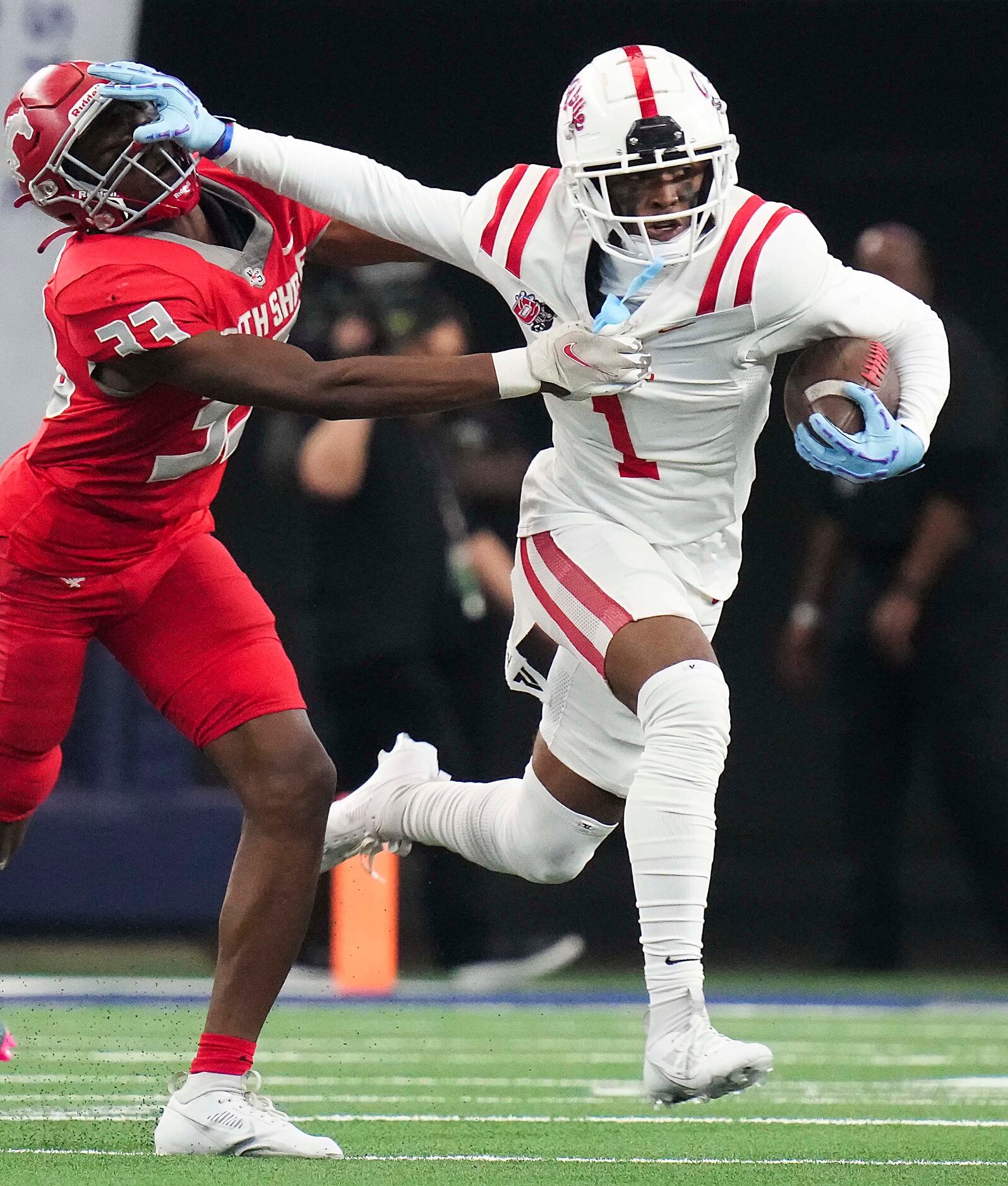 Duncanville’s Dakorien Moore (1) pushes past Galena Park North Shore’s Chace Calicut (33)...