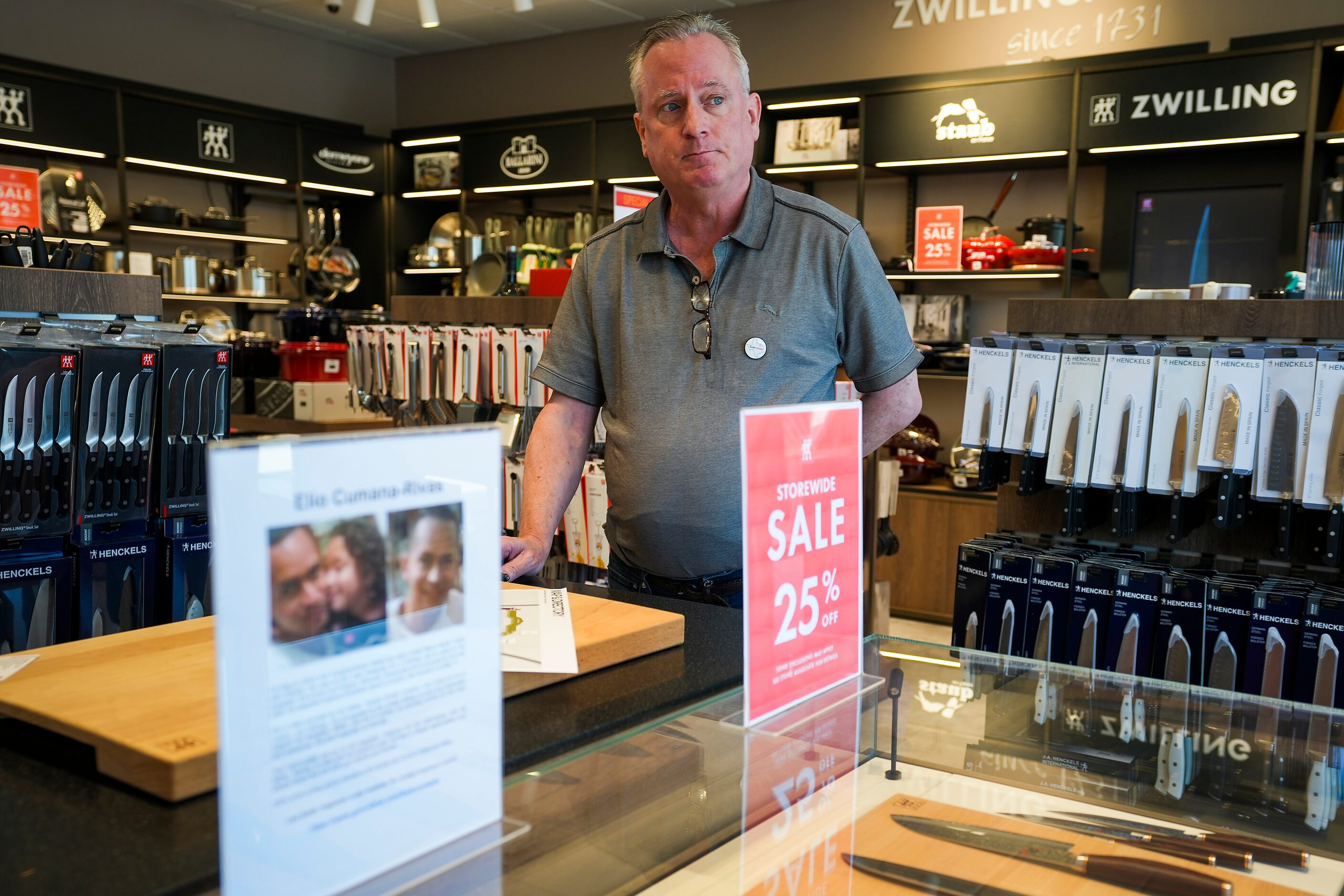 Zwilling Factory Store manager Marcus Kergosien looks out from his shop behind a small...