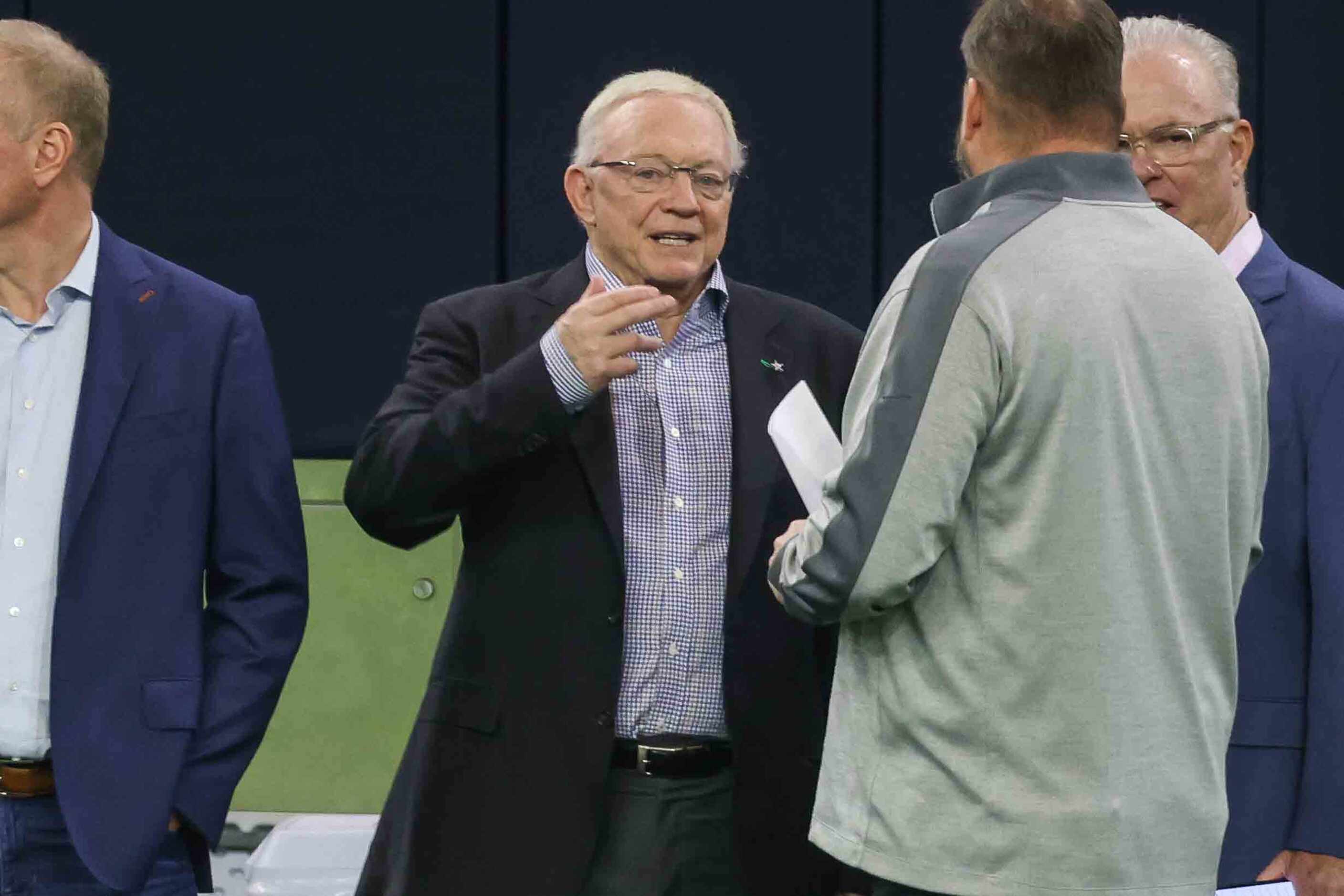 Jerry Jones, owner, president, and general manager of the Dallas Cowboys on the field during...