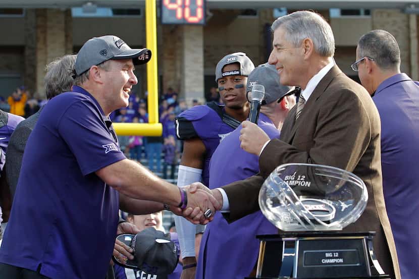 TCU head football coach Gary Patterson shakes hands with Big 12 Commissioner Bob Bowlsby...