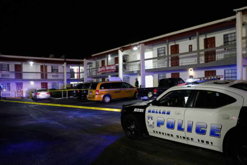 Dallas police investigated at a Red Roof Inn on Sunday after one man was killed and another...