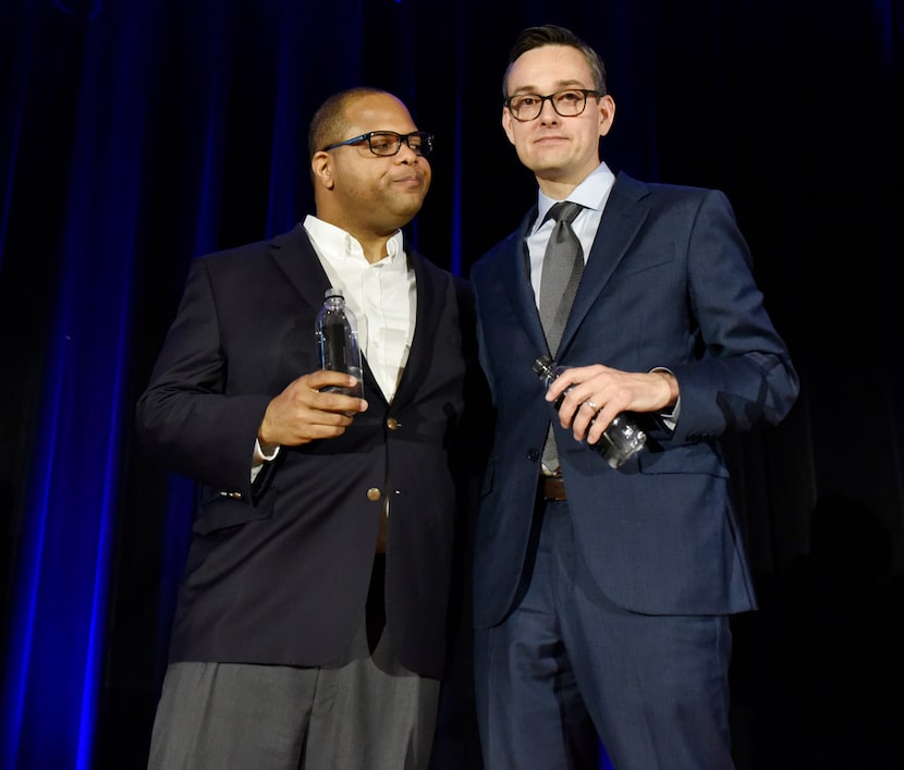 Dallas mayoral candidates Eric Johnson (left) and Scott Griggs spoke to each other after...