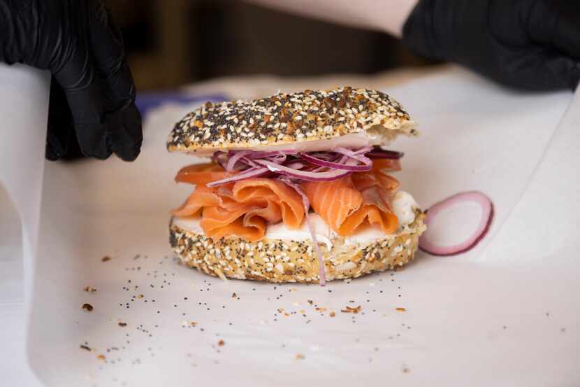 An everything bagel with lox is wrapped at Dan's Bagels in Trophy Club on Thursday, Feb. 8,...