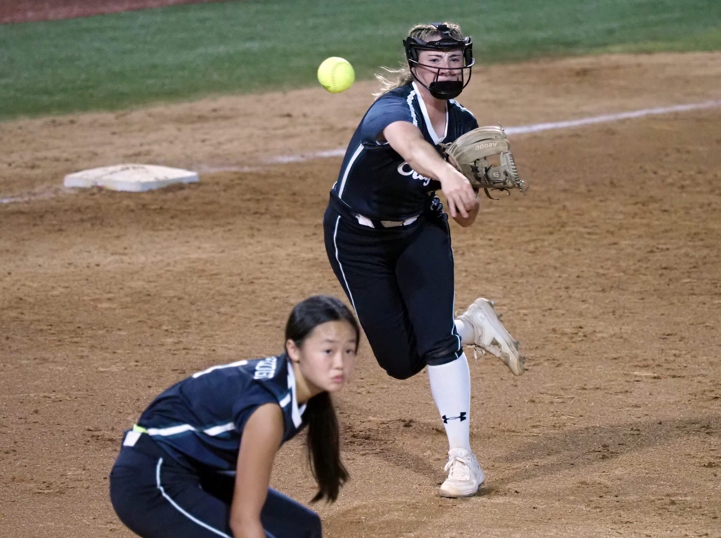 Mansfield Lake Ridge third baseman Jordan Householder (right) throws to first against...