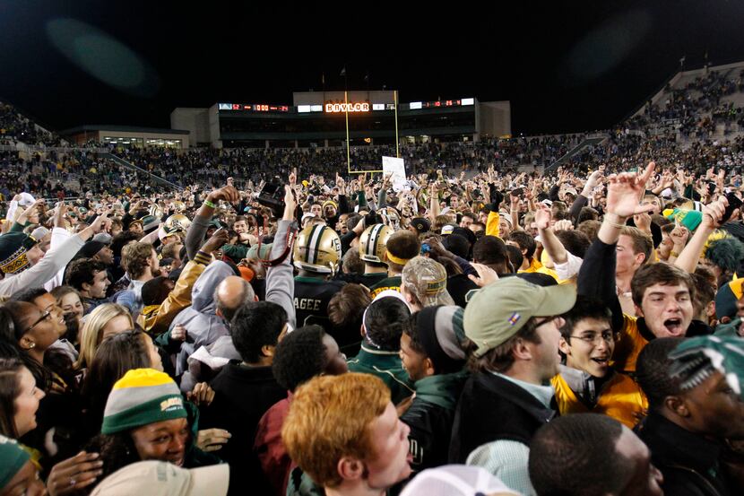 Baylor Bears players and fans celebrate an upset victory over Kansas State Wildcats at Floyd...