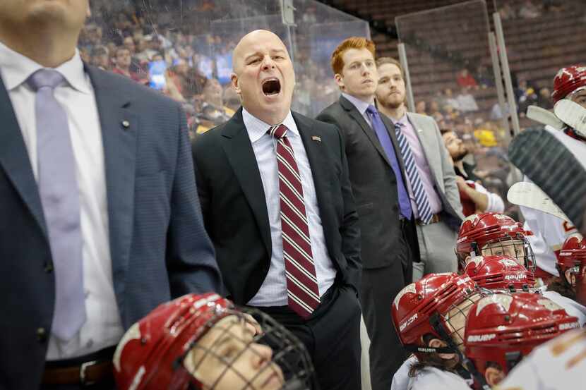Denver head coach Jim Montgomery works the bench during the first period in the regional...
