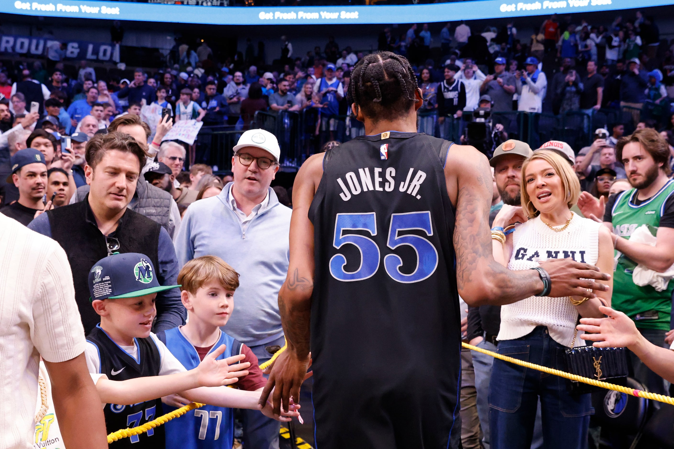 Dallas Mavericks forward Derrick Jones Jr. (55) exits through the crowd after an NBA...