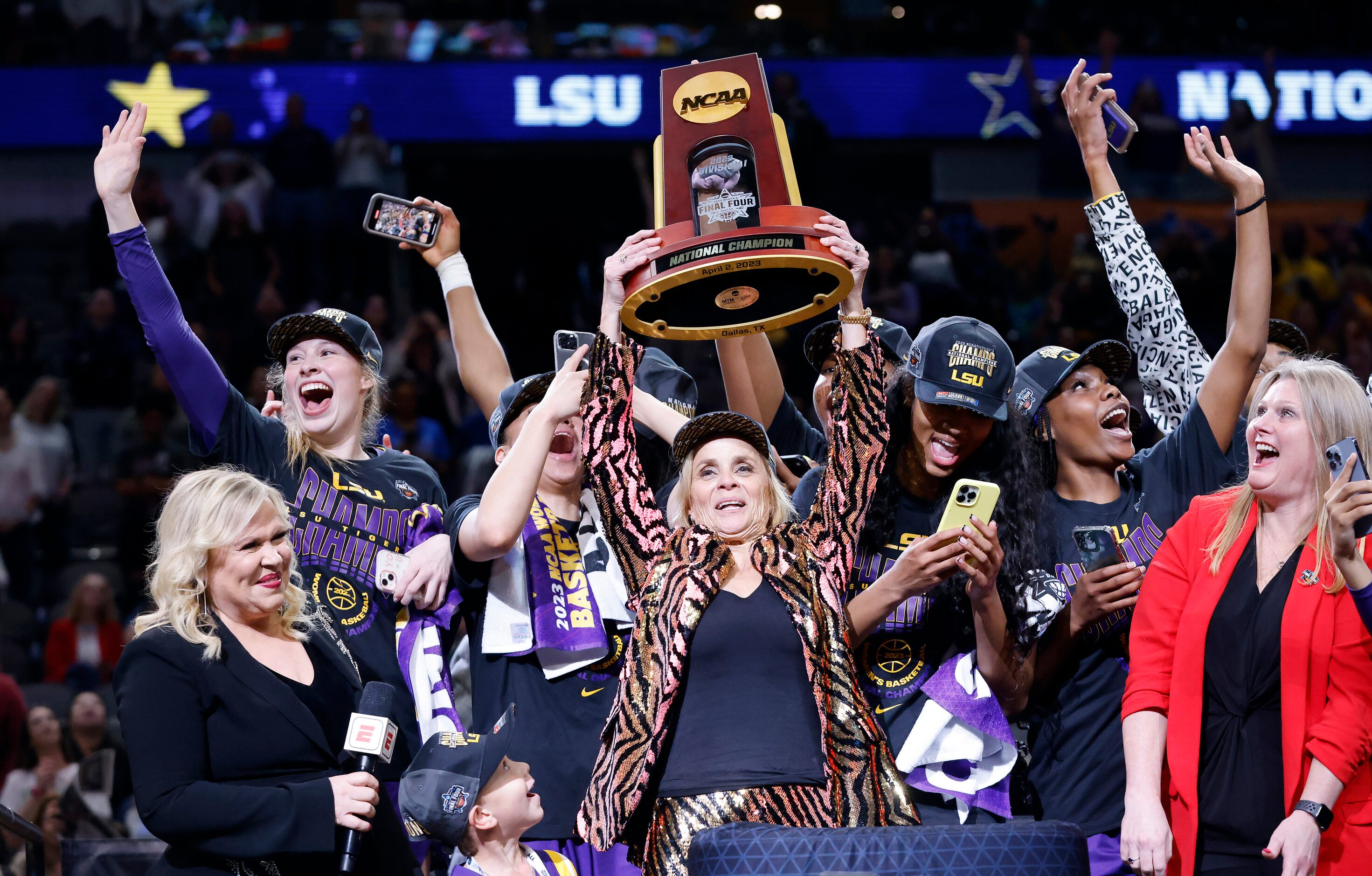 LSU Lady Tigers head coach Kim Mulkey hoist the NCAA Women’s Basketball Championship trophy...