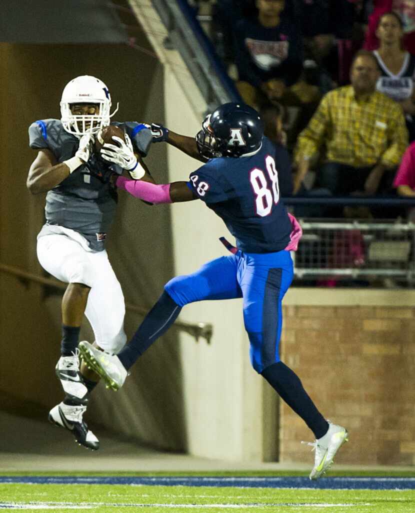 Hebron defensive back Isaiah Gary (1) intercepts a pass intended for Allen wide receiver...