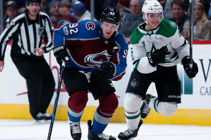 Colorado Avalanche left wing Gabriel Landeskog, left, of Sweden, drives down the ice with...