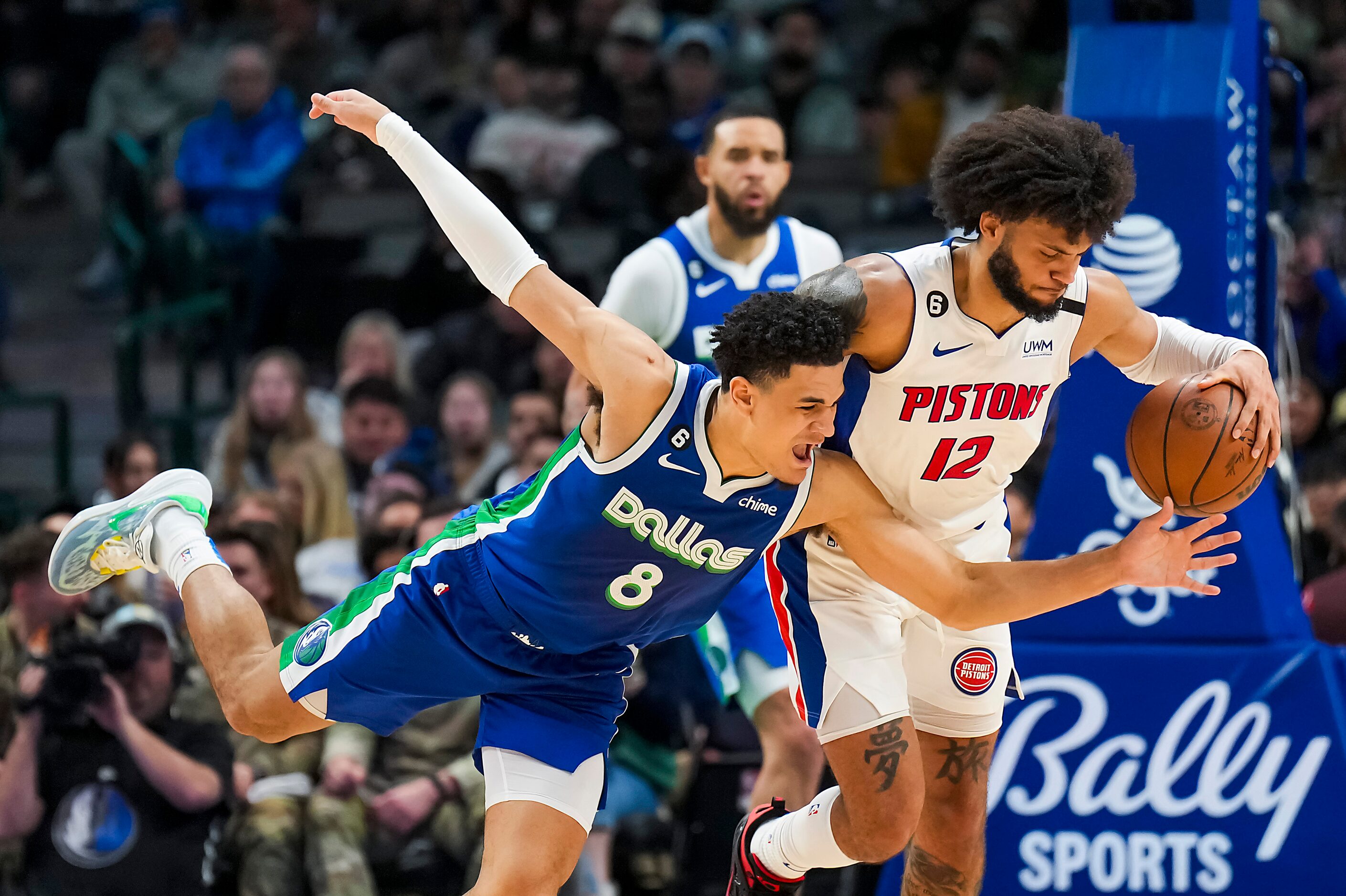 Detroit Pistons forward Isaiah Livers (12) steals the ball from Dallas Mavericks guard Josh...