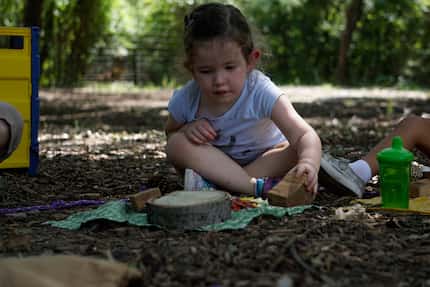 Emery Baumhardt, 3, plays outside at the Dallas Zoo's Wild Earth Preschool on Thursday.
