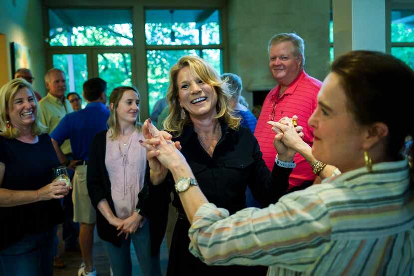 Dallas City Council member Jennifer Staubach Gates celebrates with supporters after early...