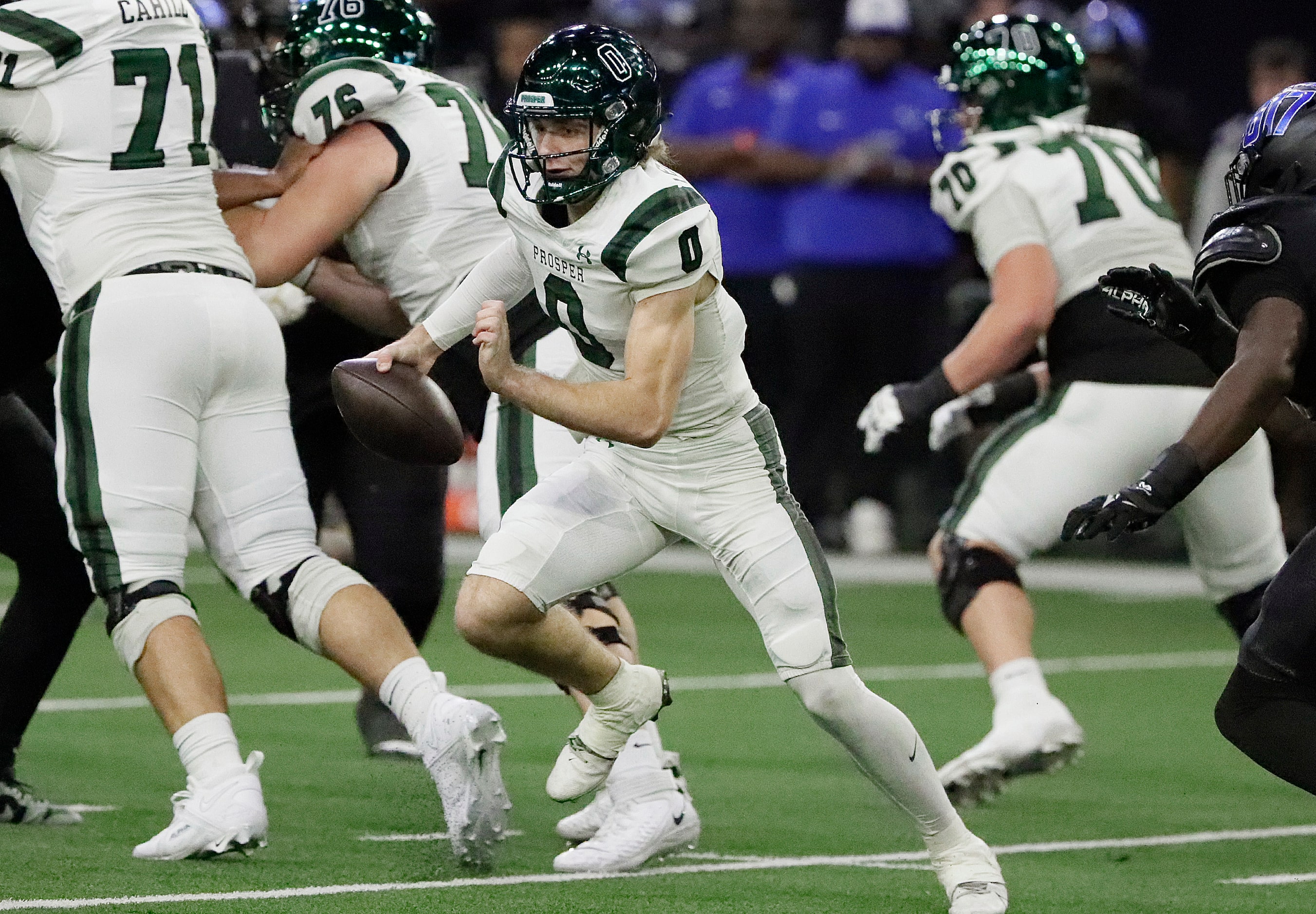 Prosper High School quarterback Nathan TenBarge (0) is forced out of the pocket during the...