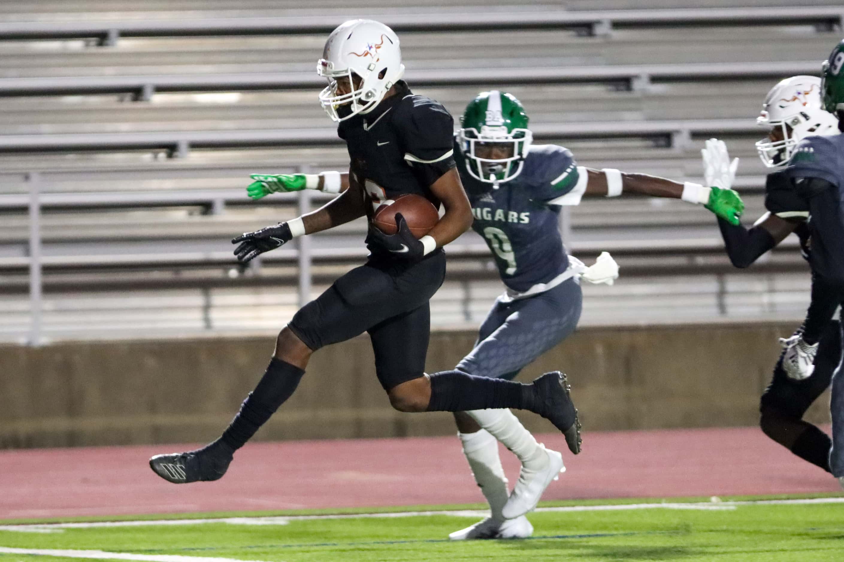 W.T. White wide receiver DeJon Baker (13) high steps into the end zone for a touchdown...