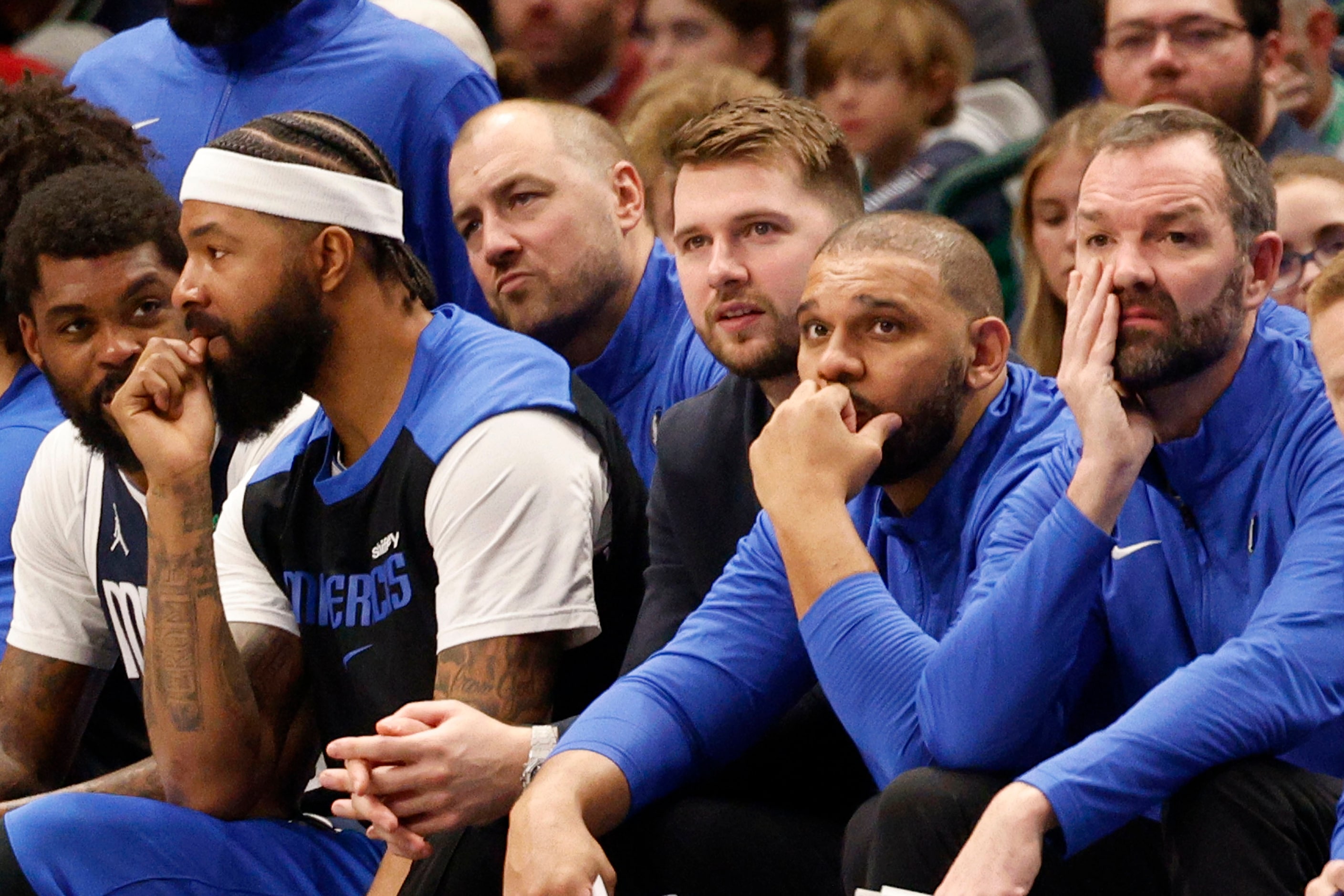 Dallas Mavericks guard Luka Doncic (77) ,center, is seen during the first half of an NBA...