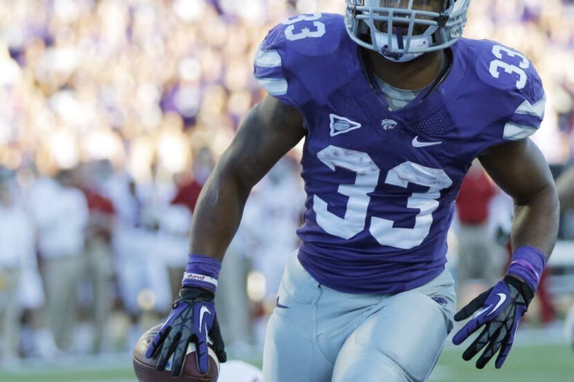 Kansas State running back John Hubert (33) scores on one of his two touchdown runs against...