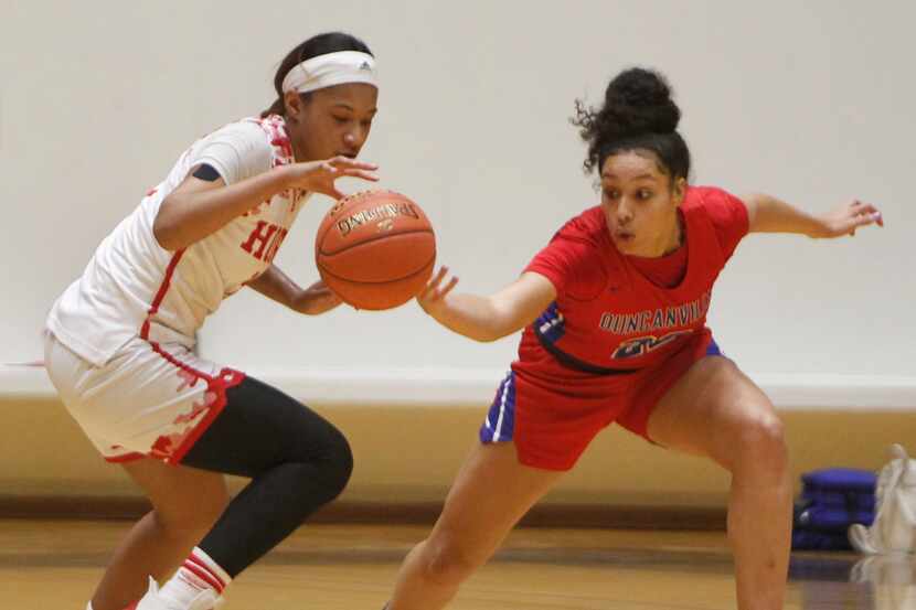 Duncanville forward Laila McLeod (22), right, attempts to knock the ball away from Mesquite...