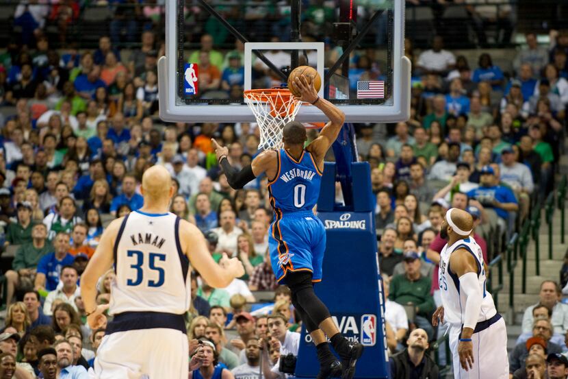 /Russell Westbrook (0) of the Oklahoma City Thunder dunks the ball against the Dallas...