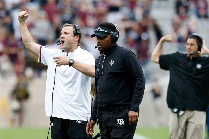 Texas A&M Aggies offensive coordinator calls in the play on fourth down next to Texas A&M...
