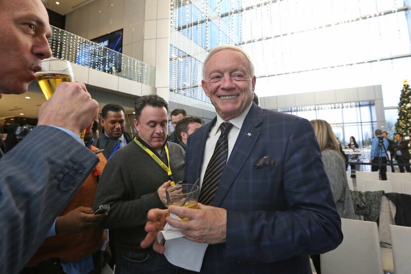 Jerry Jones jokes with the media as he hosts a news conference and reception to announce new...