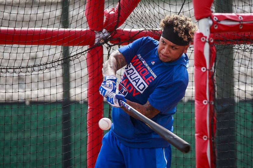 Texas Rangers outfielder Willie Calhoun takes batting practice during a spring training...