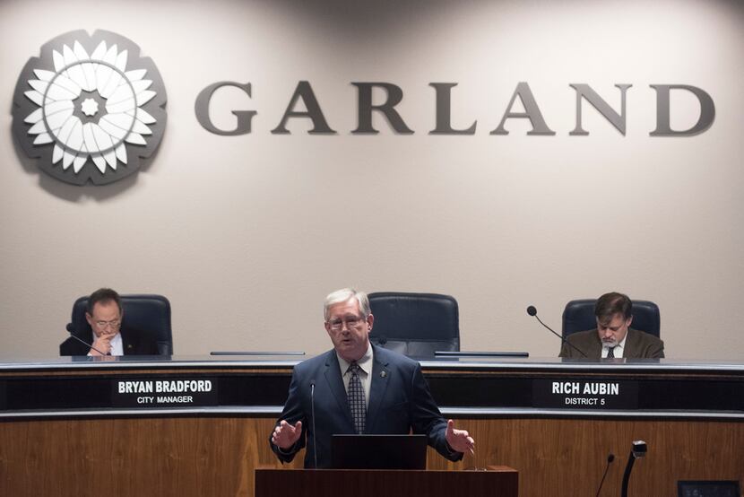 Garland Mayor Douglas Athas speaks before the start of the city council meeting on Tuesday,...