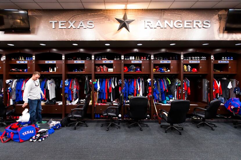 Texas Rangers relief pitcher Sam Dyson cleans out his locker at Globe Life Park on Tuesday,...