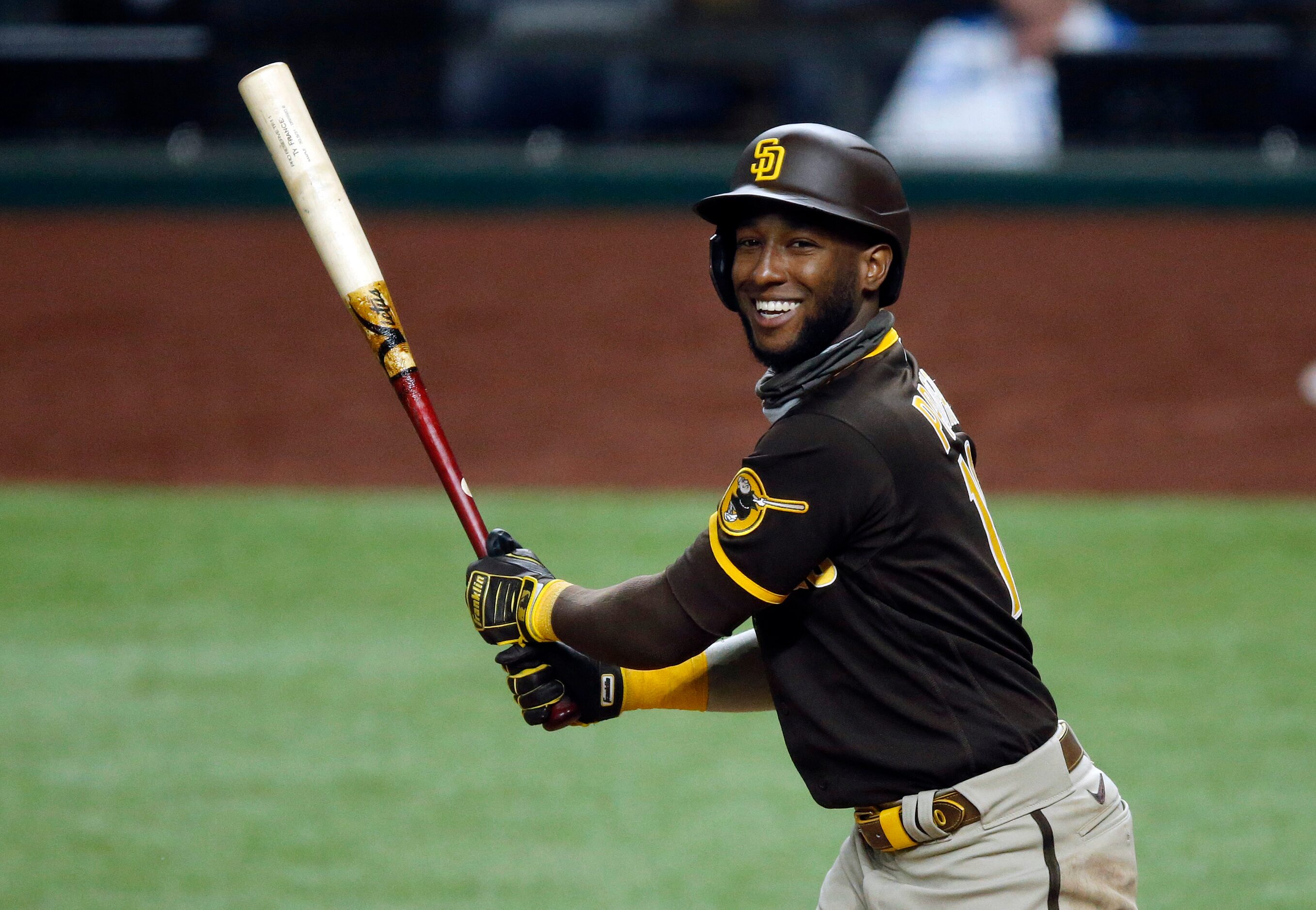 Former Texas Rangers and current San Diego Padres left fielder Jurickson Profar (10) smiles...