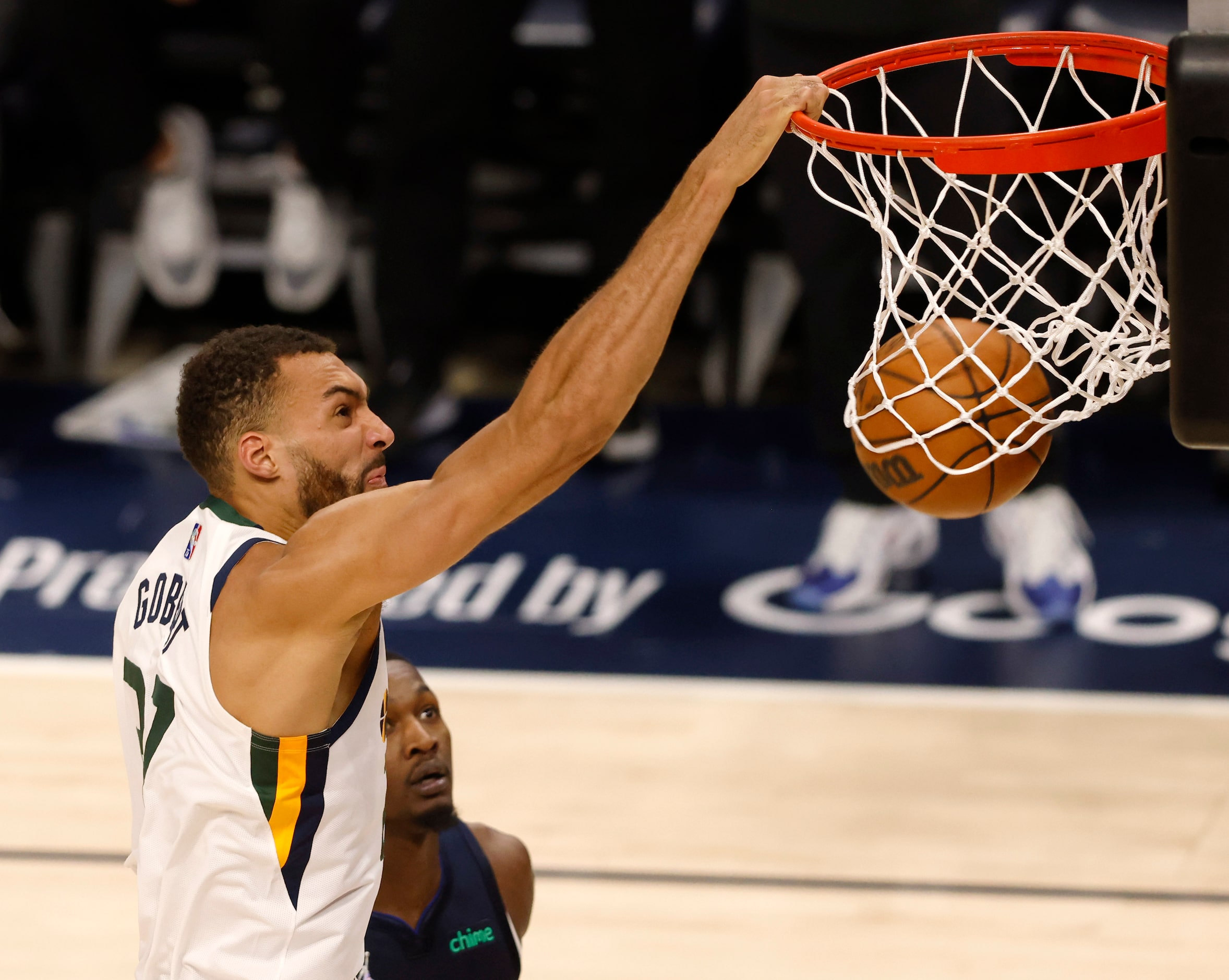 Utah Jazz center Rudy Gobert (27) dunks the ball in front of Dallas Mavericks forward Dorian...