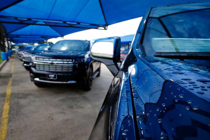 Rains drops cover the hood of a General Motors' Chevrolet Tahoe sport utility vehicle at...
