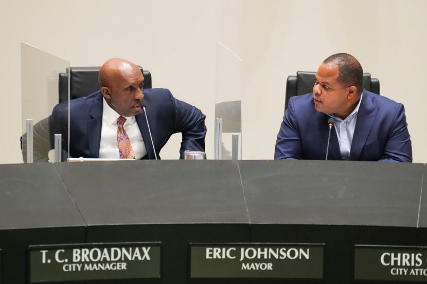 Dallas City Manager T.C. Broadnax takes his seat next to Mayor Eric Johnson during a meeting...