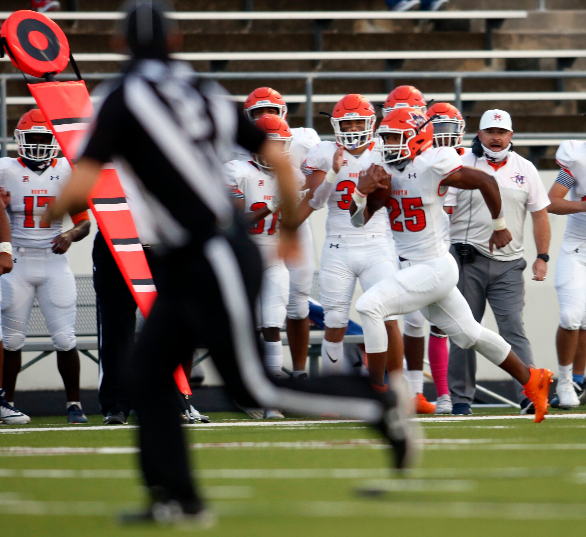 McKinney North running back Jayden Smith (25) breaks to the outside and down the sideline in...