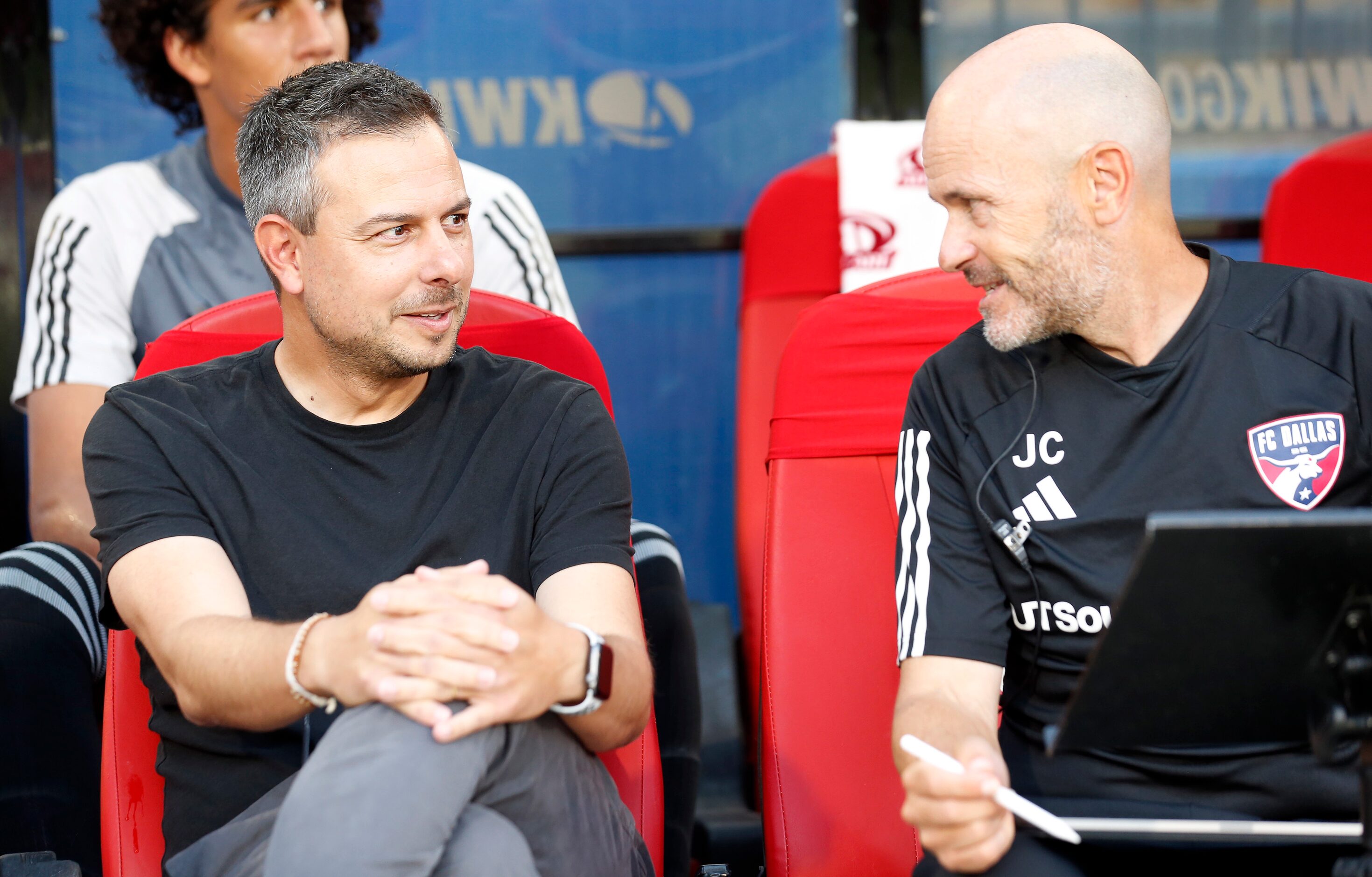 FC Dallas head coach Nico Estévez (left) and assistant Javier Cabello visit before their...