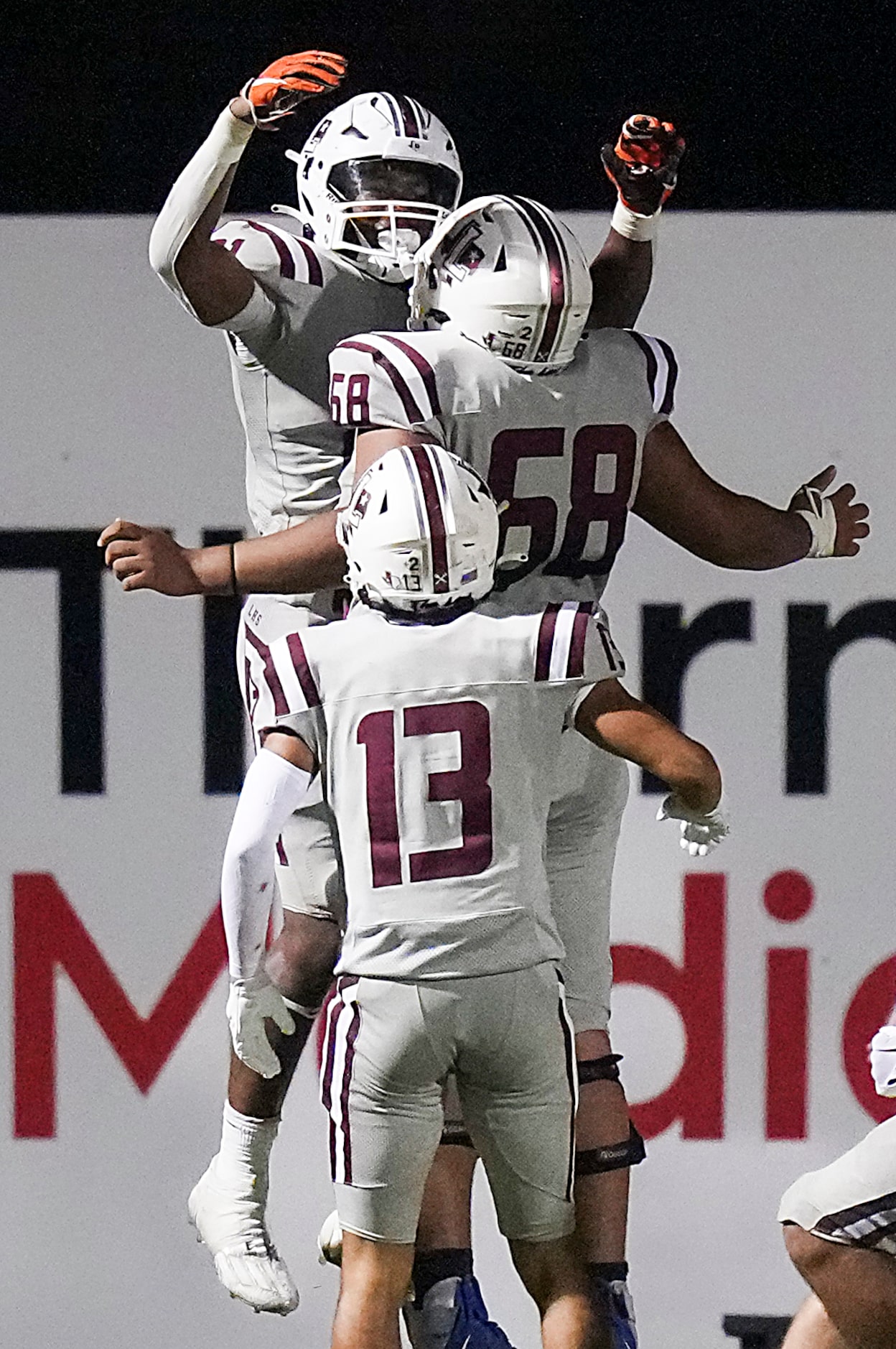 Lewisville running back Viron Ellison (21) celebrates with offensive lineman Kylan Masters...