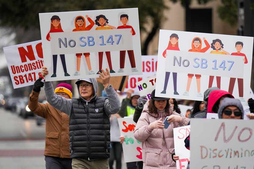Demonstrators marched in opposition to Texas Senate Bills 147 and 552 on Jan. 29 in Dallas....