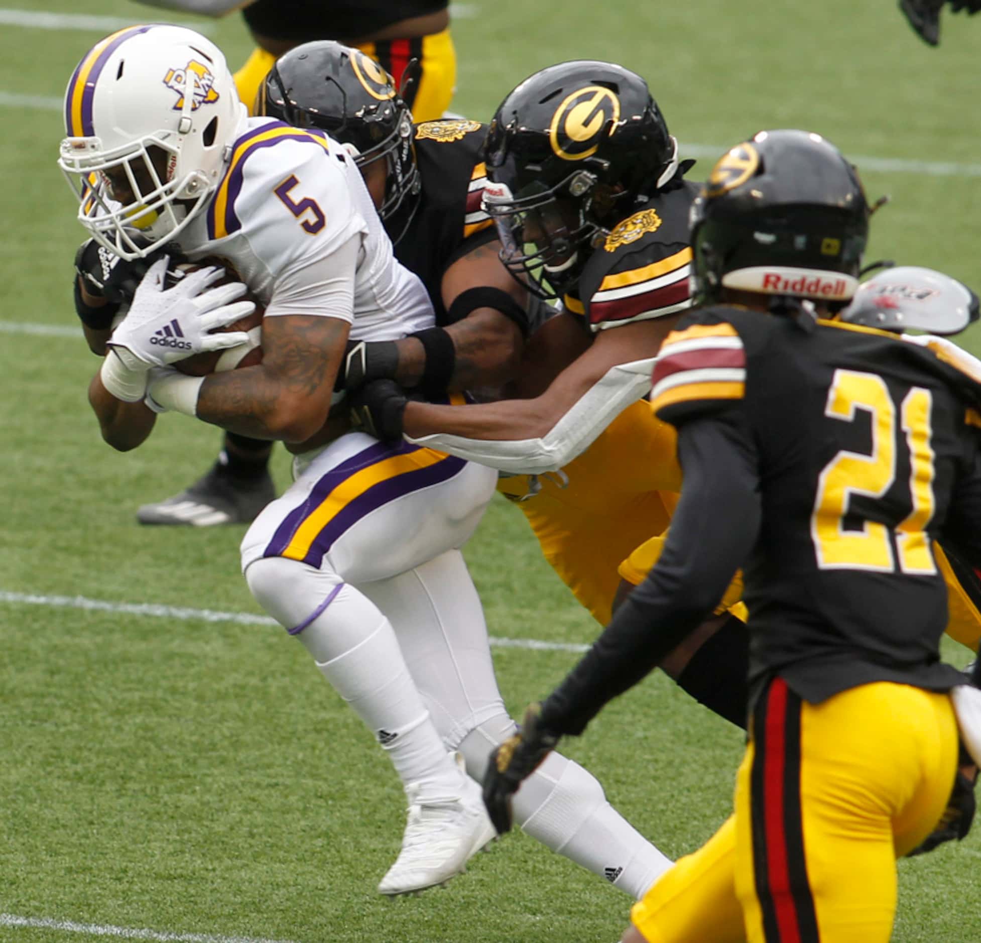 Prairie View A&M's Ahmad Antoine (5) picks up a first down as he attracted the attention of...